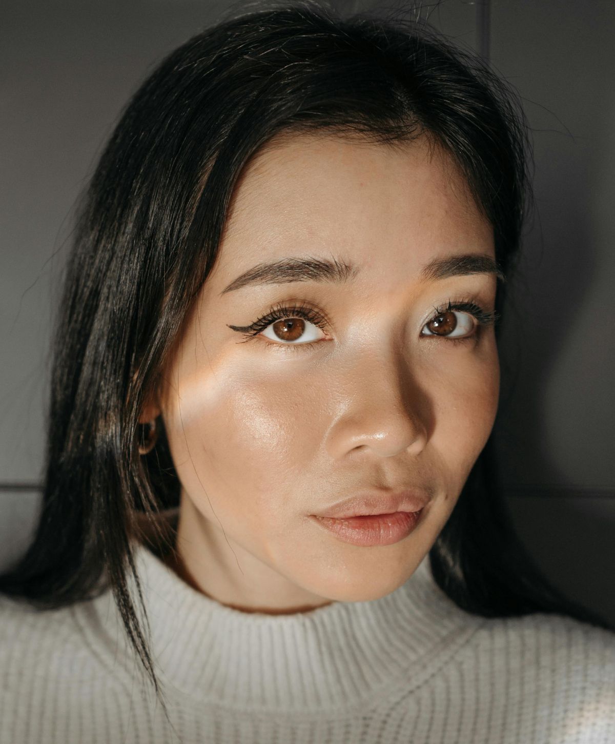 Close-up portrait of a Avon Botox model with long hair.