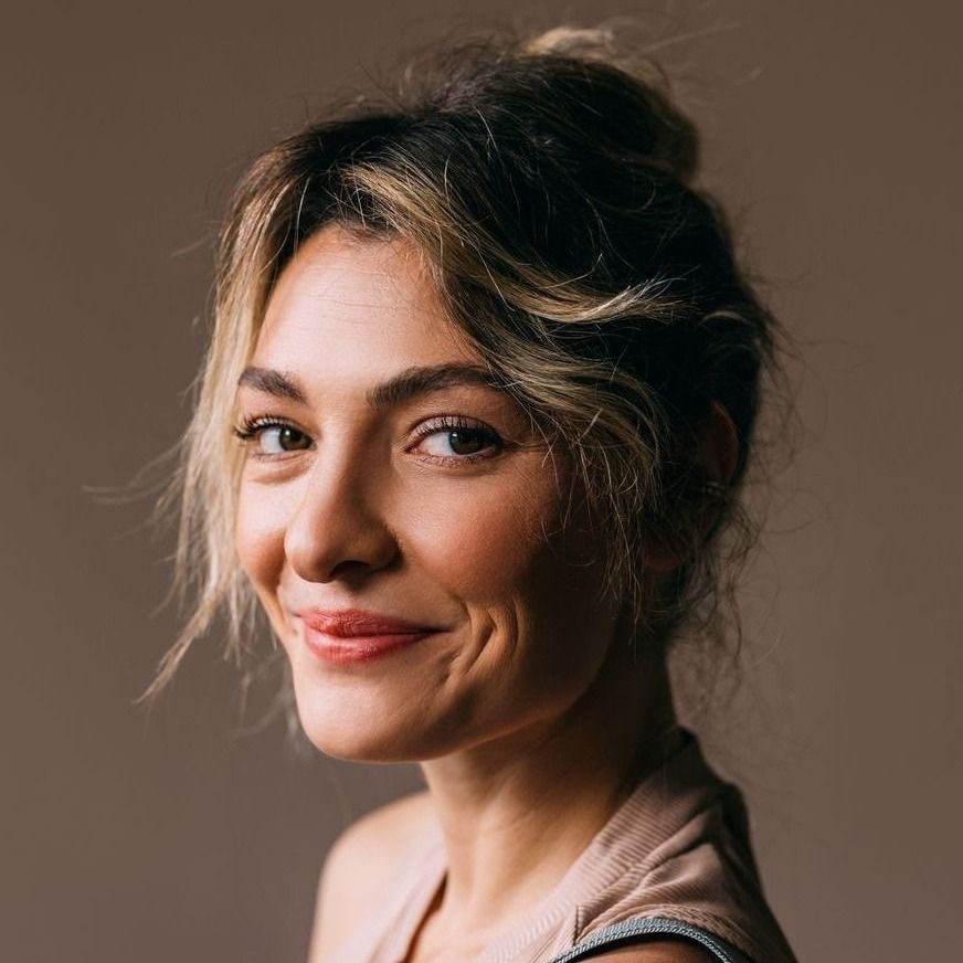 Farmington deep plane facelift model with tousled hair and warm expression.