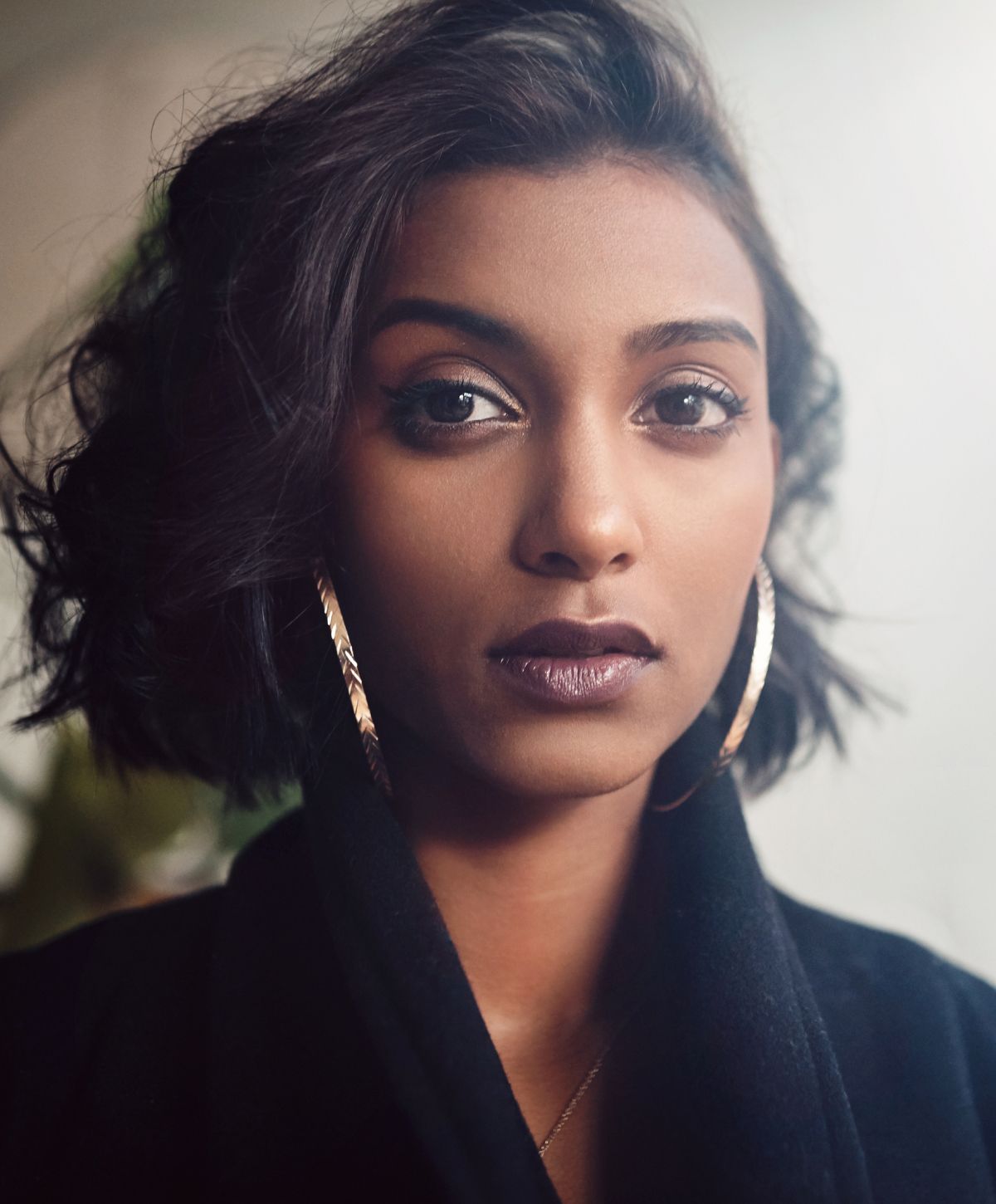 Farmington CO2 skin resurfacing model portrait with stylish short hair and earrings.