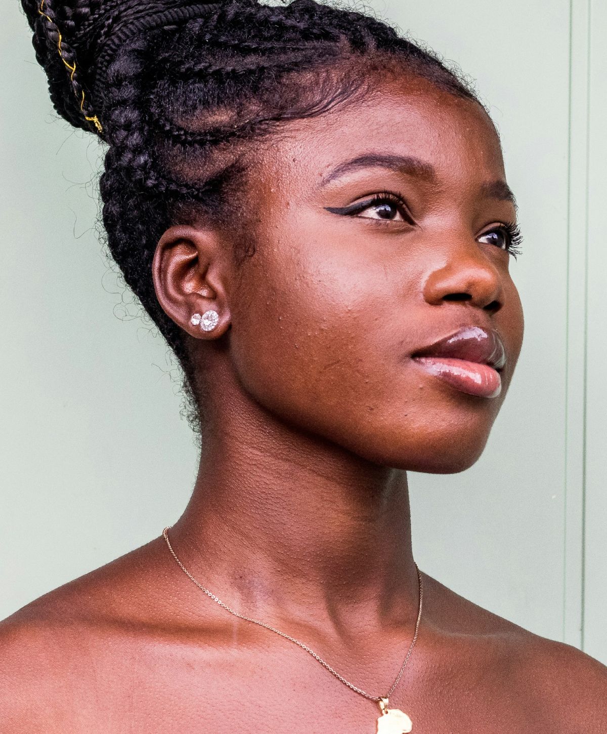 Portrait of an Avon laser hair removal model with braids.
