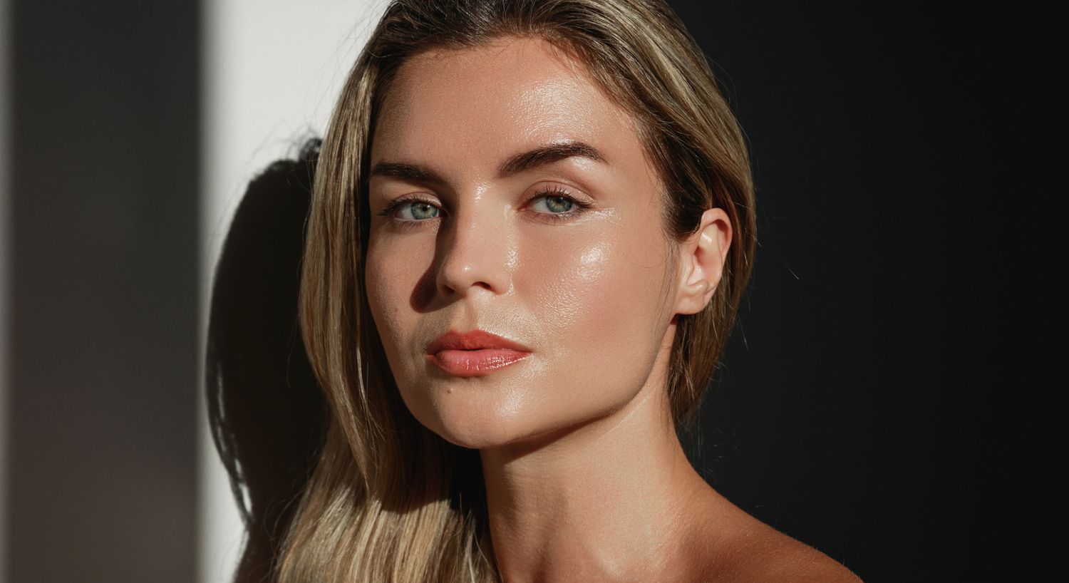 Portrait of a Farmington neck lift model with natural lighting.