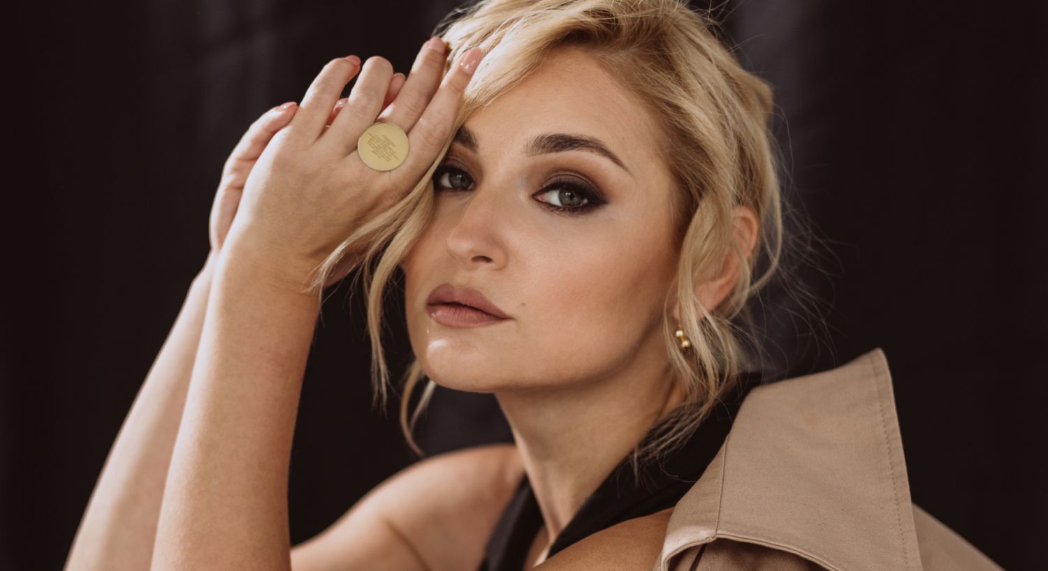 Avon eCO2 laser peel model with elegant makeup and stylish pose.