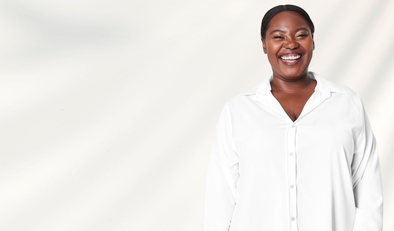 Farmington areola reduction model exercising in athletic wear, relaxing pose.